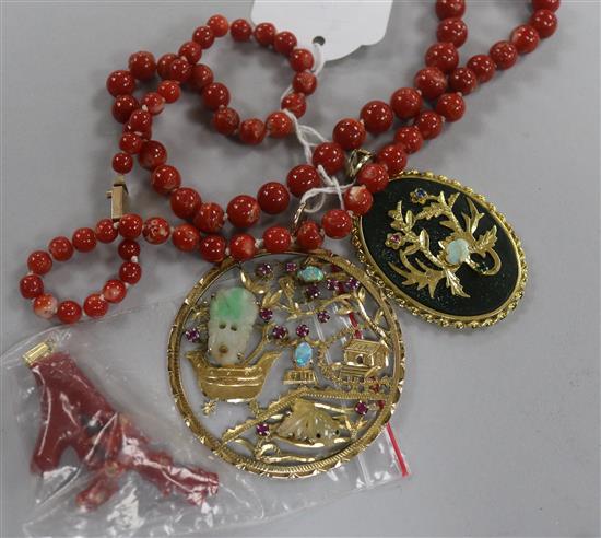 A Chinese 18ct gold and multi gem set pierced circular pendant, one other pendant and two items of coral.